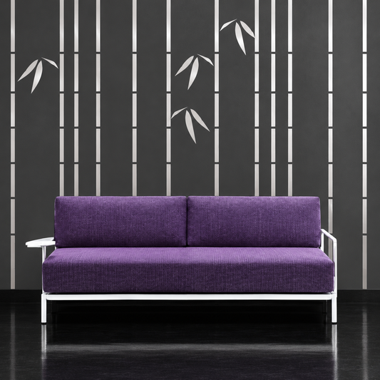 Metallic silver slender bamboo on charcoal wall behind a purple sofa, wide view