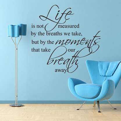Life moments and breath wall quote on a blue wall