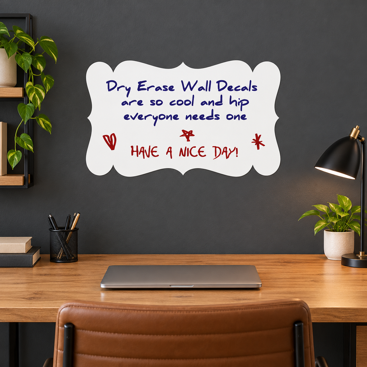 White decorative plaque dry erase decal on a charcoal office wall above an oak desk