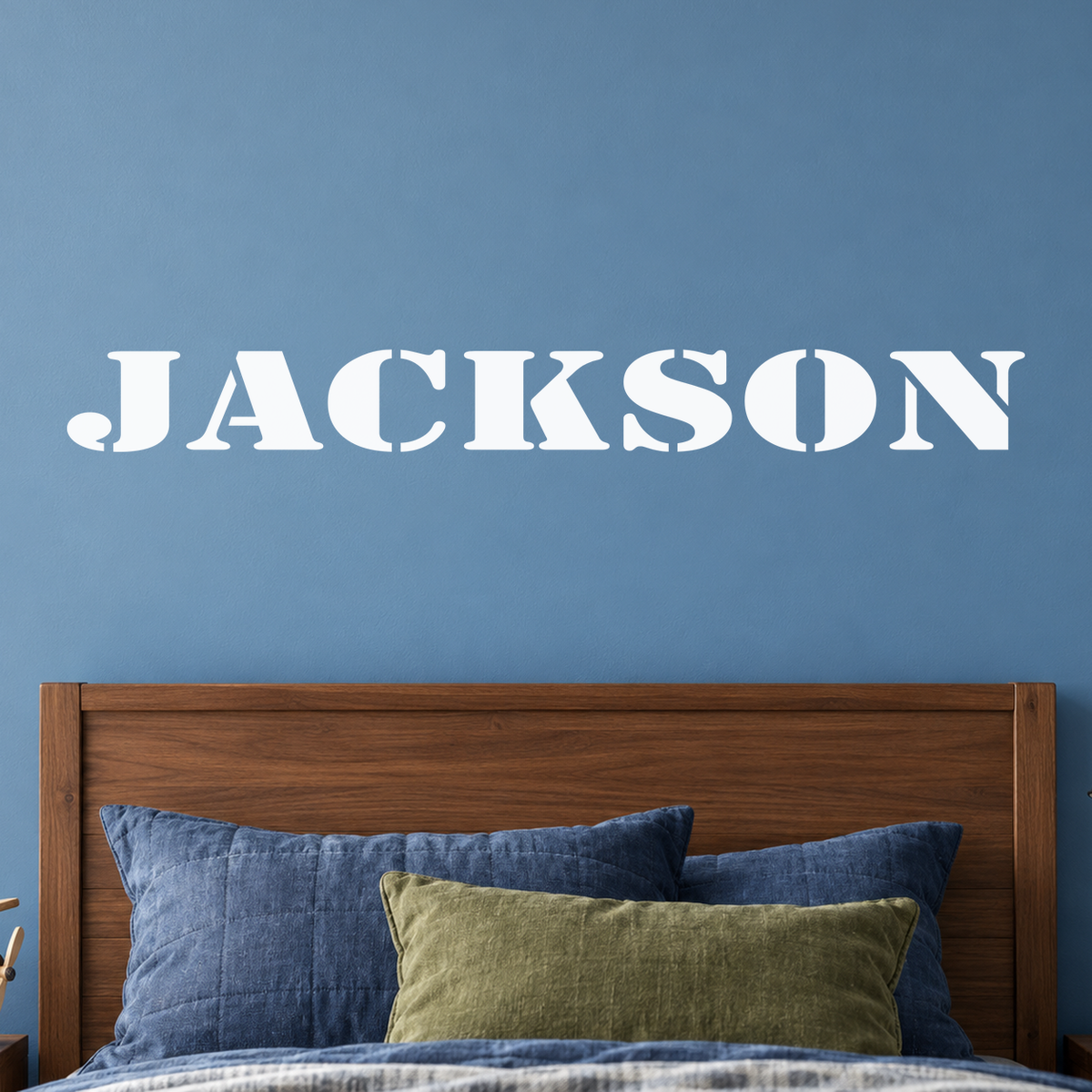 Close-up custom lettering example on a smooth wall