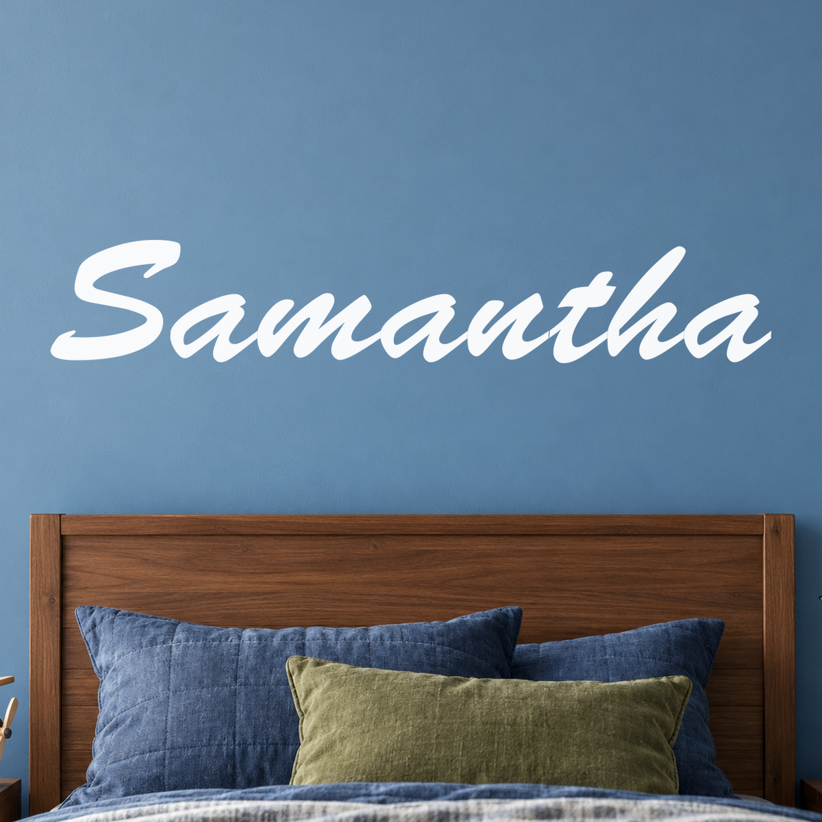 Close-up custom lettering example on a smooth wall