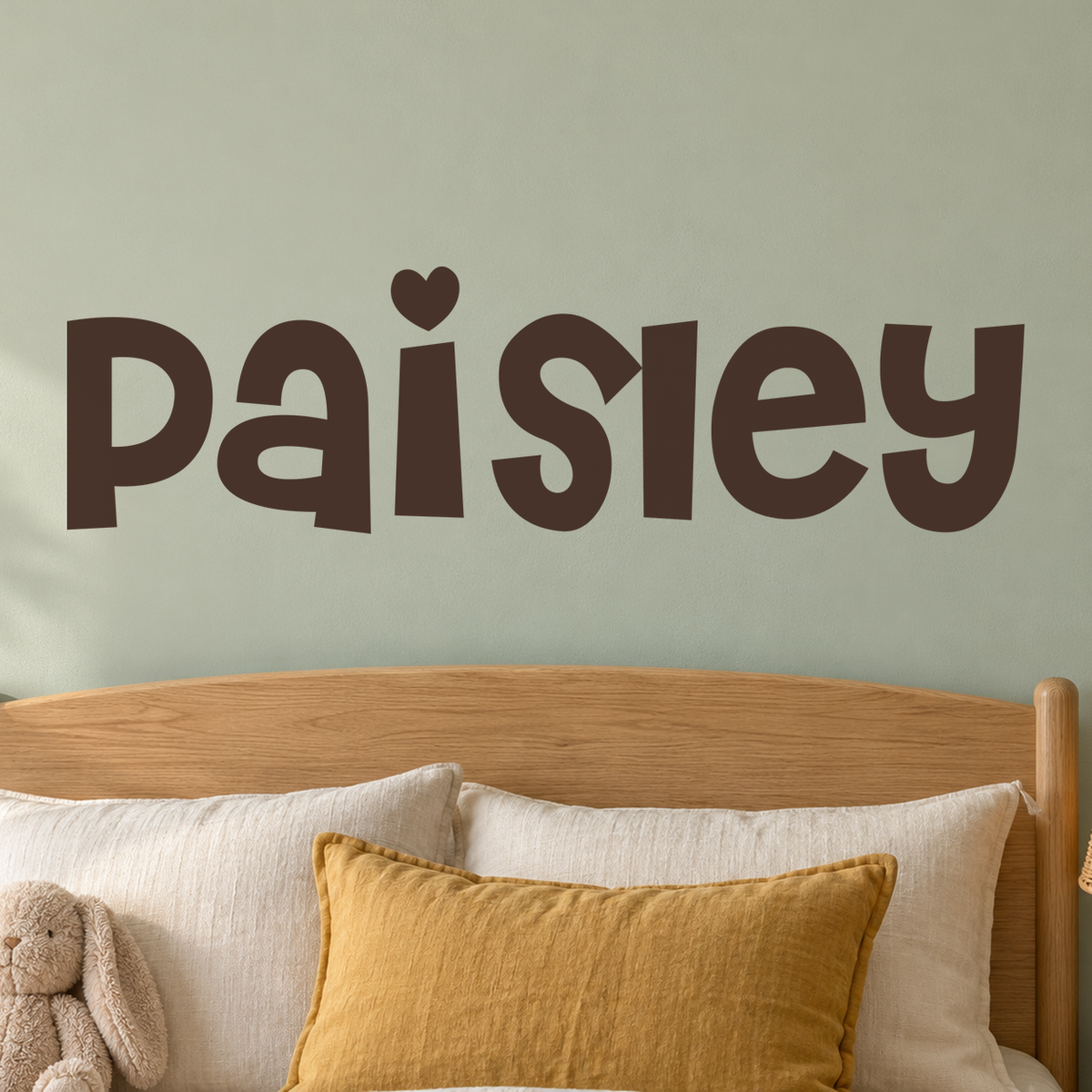 Close-up custom lettering example on a smooth wall