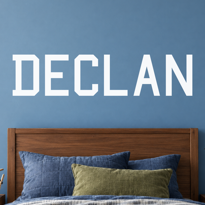 Close-up custom lettering example on a smooth wall