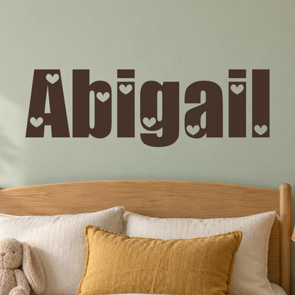 Close-up custom lettering example on a smooth wall