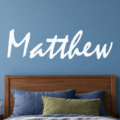 Close-up custom lettering example on a smooth wall