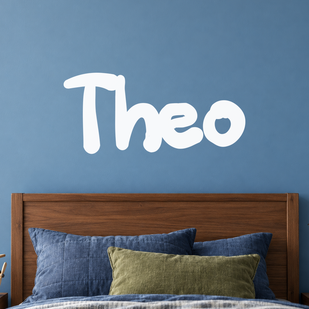 Close-up custom lettering example on a smooth wall