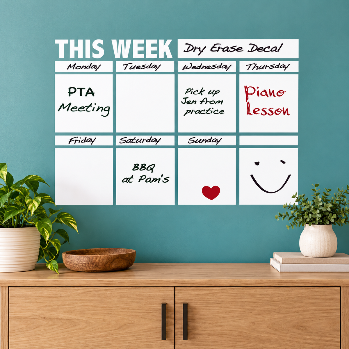 Weekly dry erase calendar wall decal — 23 × 33 inch layout above an oak console