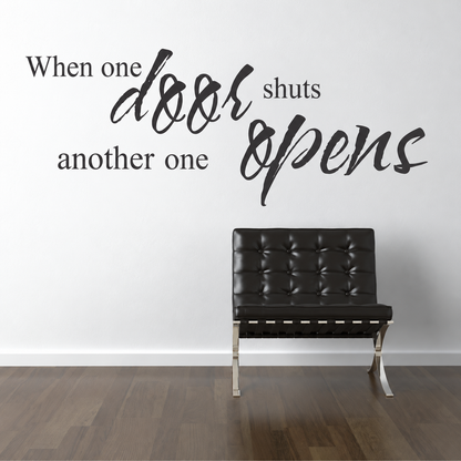 when one door shuts another opens wall quote decal displayed on a wall